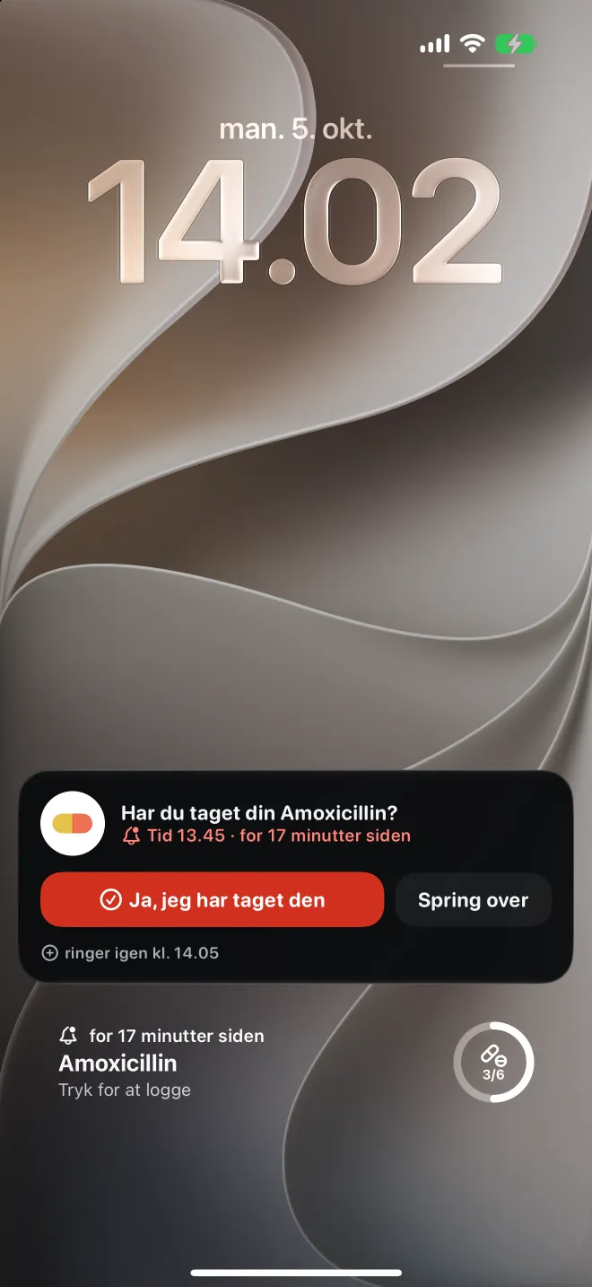 En forsinket dosis på iPhonens låseskærm med en knap til at registrere den